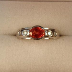 CroppedImage400400 nat orange sapp bezel ring