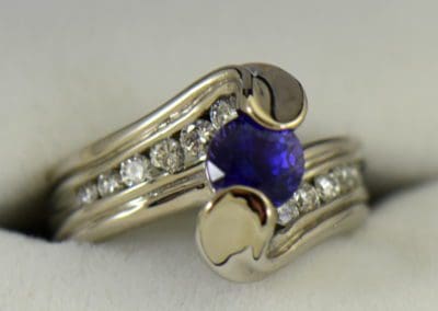 Custom palladium wedding ring with round blue purple color change sapphire