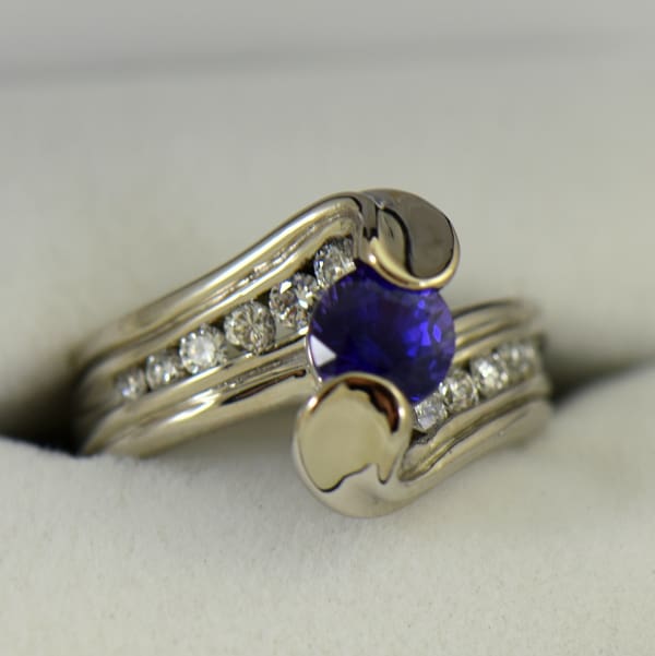 Custom palladium wedding ring with round blue purple color change sapphire