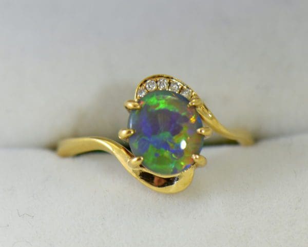 Australian Semi Black Opal set in Yellow Gold Bypass Ring Mounting with Diamond Accents 2.JPG