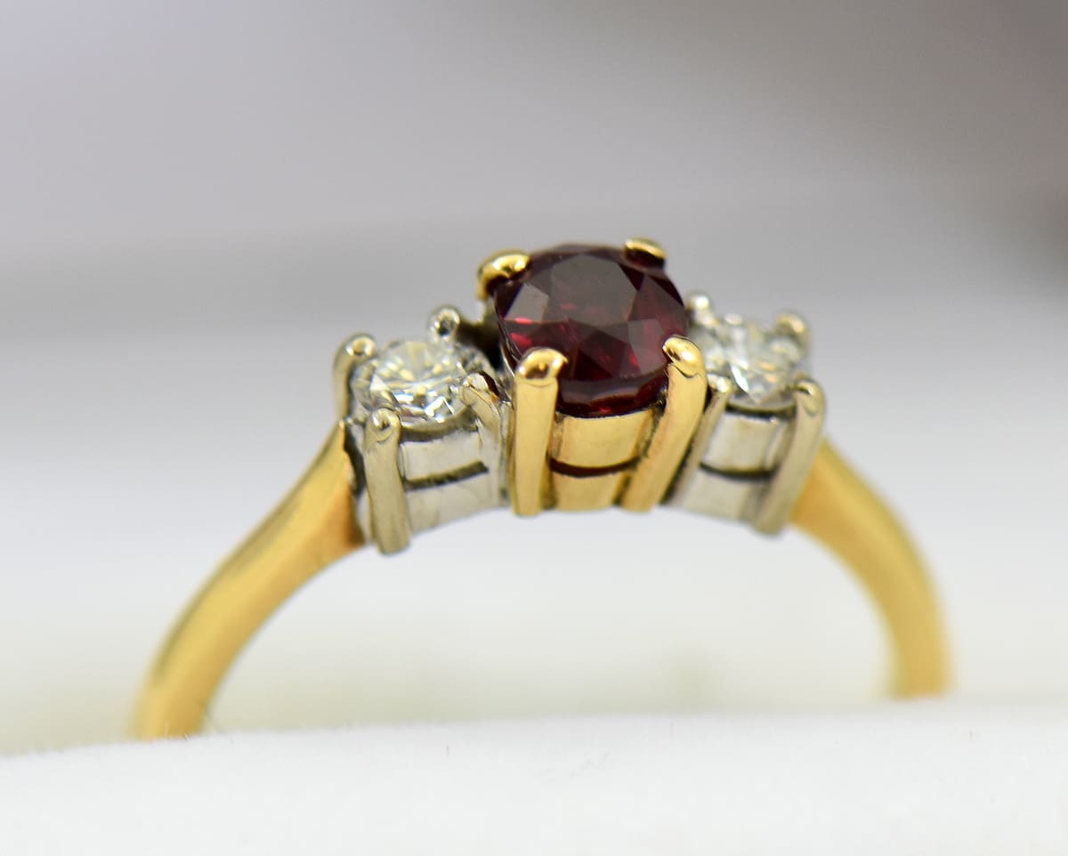 Ruby ring with two diamonds on sale