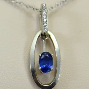 Modern Estate Oval Blue Sapphire Diamond Pendant with movable white gold frame.JPG