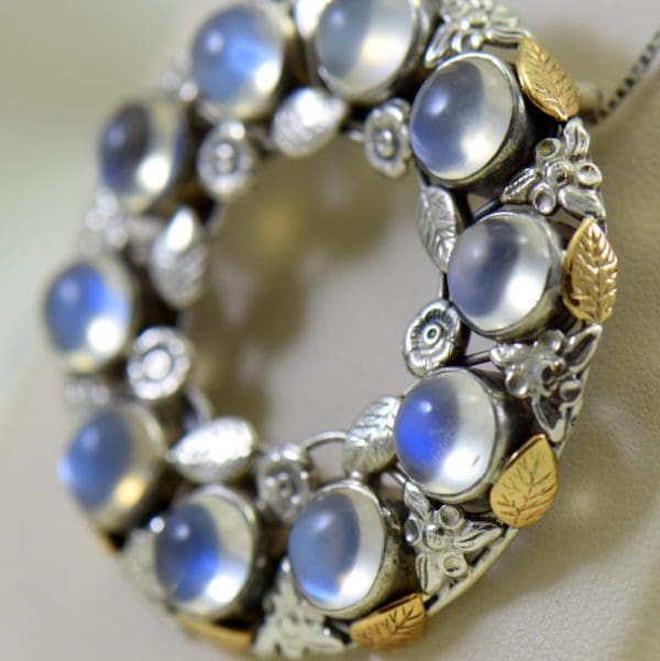 large 1930s floral wreath pendant with blue moonstones in sterling and 14k 4.JPG