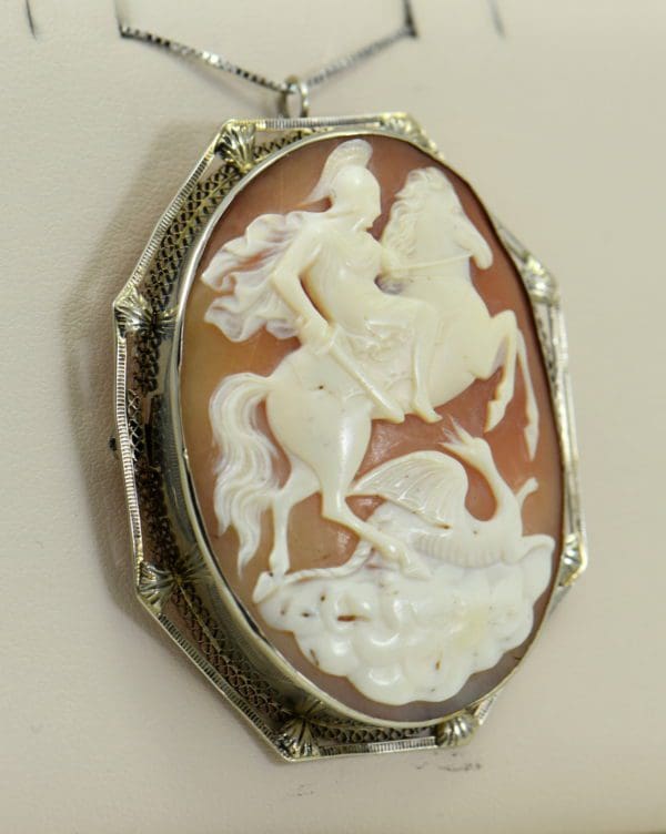 art deco shell cameo pin pendant combo with knight slaying dragon in white gold frame.JPG