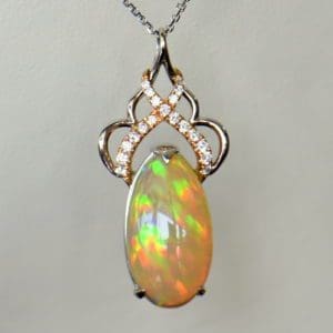 Ethiopian Crystal fire opal pendant with snakeskin pattern prismatic color rose gold 2.JPG