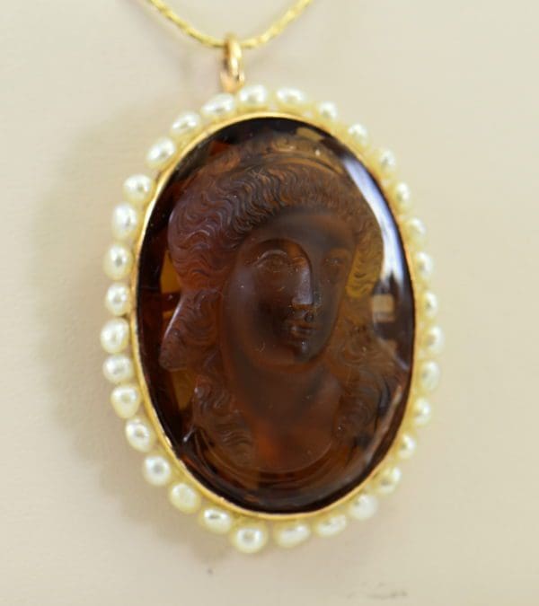hard stone cameo carved citrine woman in yellow gold frame surrounded by pearls.JPG
