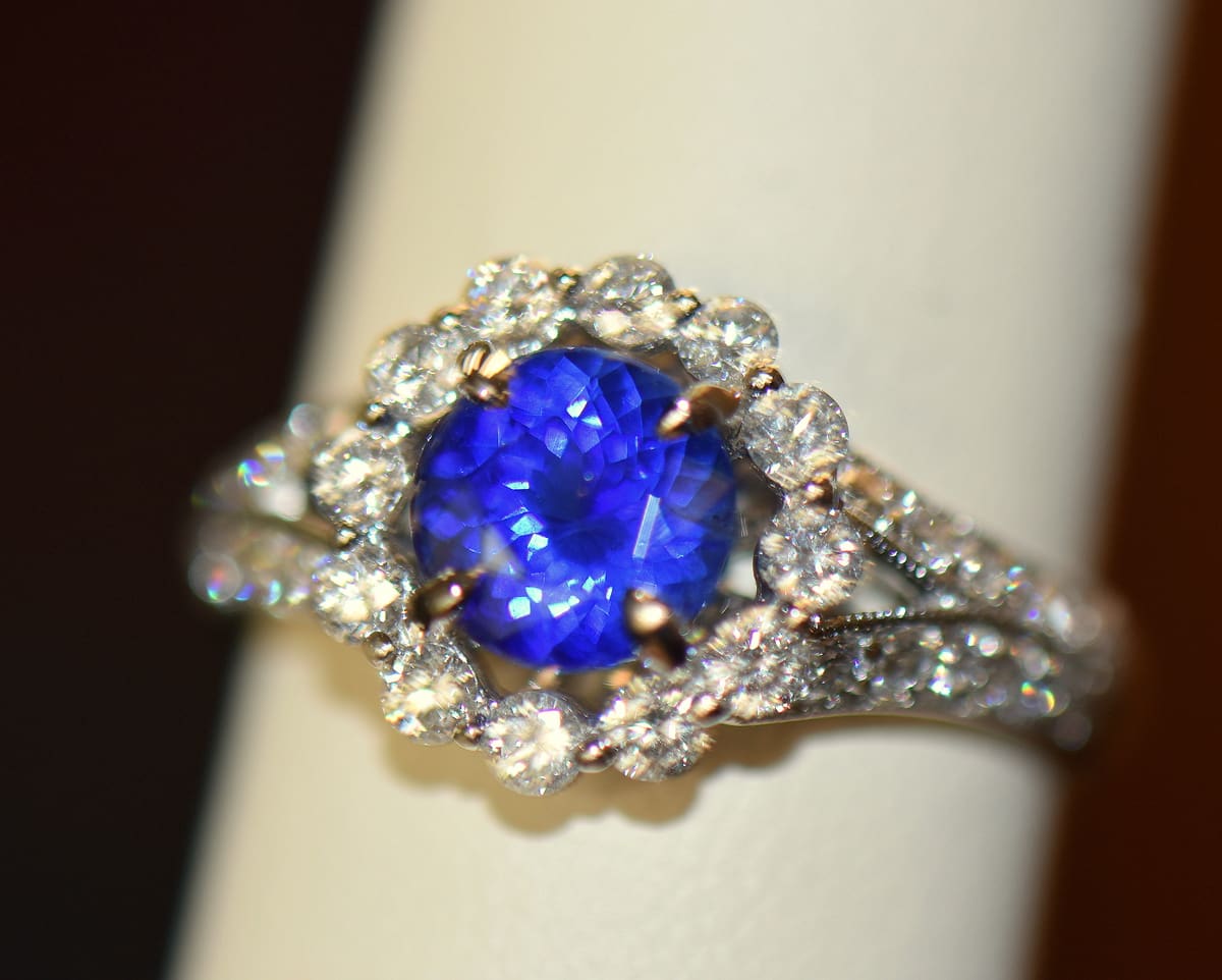 Round sapphire and diamond ring on sale