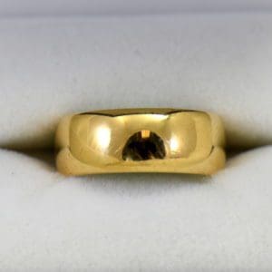 antique 7mm wide yellow gold wedding band.JPG