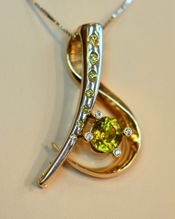 custom designed pin or pendant with sphene and yellow diamonds treble clef 6.JPG