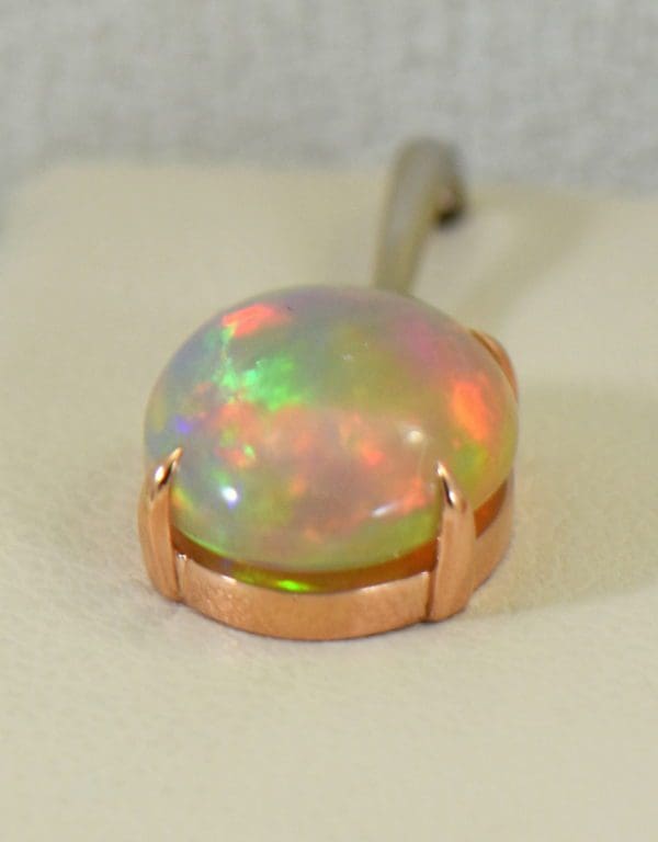 ethiopian opal earrings in rose and white gold 3.JPG