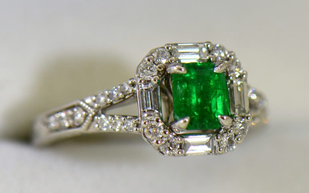 radiant cut natural emerald in baguette diamond halo engagement ring