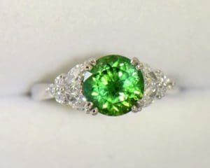 A Round Green Tourmaline Engagement Ring in White Gold