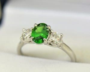 white gold three stone ring with diamonds and oval tsavorite green garnet 4.JPG Three Stone Ring Featuring Tsavorite Green Garnet in White Gold