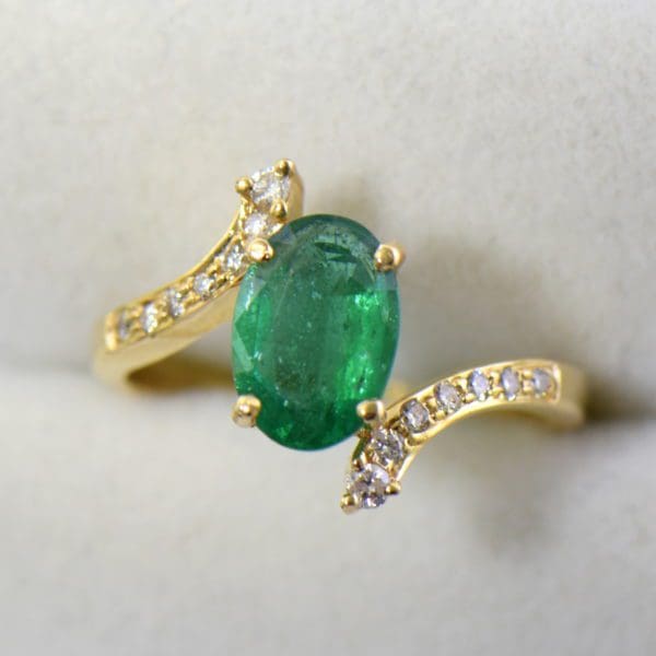 1.71ct oval emerald and diamond bypass ring african.JPG