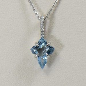 aquamarine cross necklace in white gold