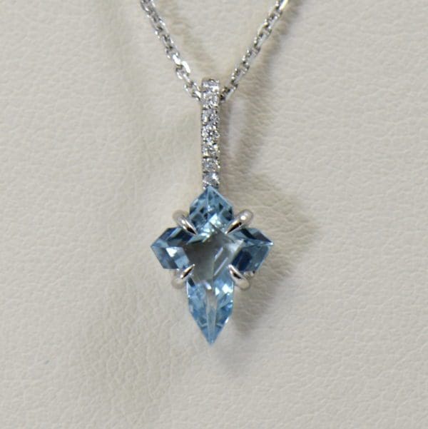 aquamarine cross necklace in white gold