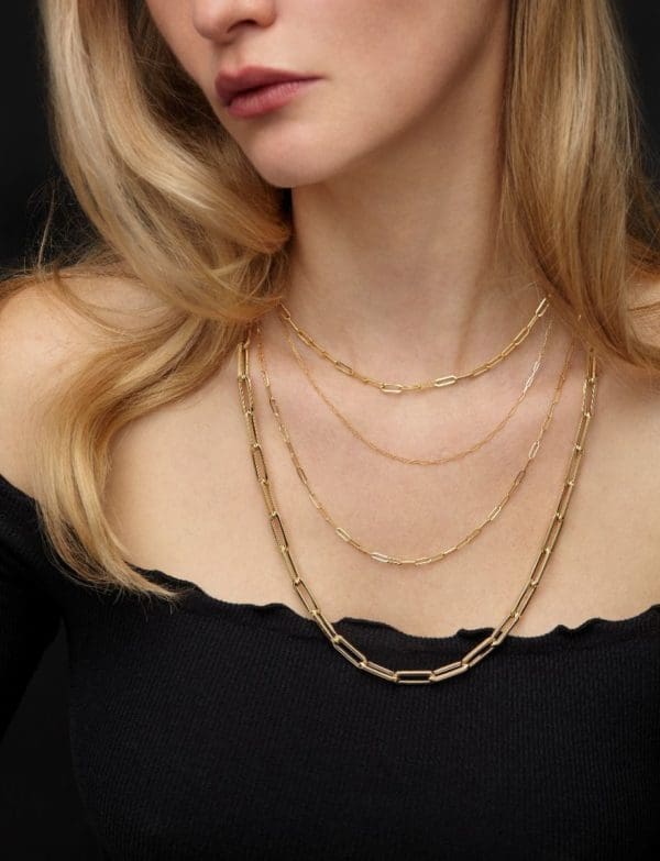 woman wearing gold paperclip chain federal way custom jewelers