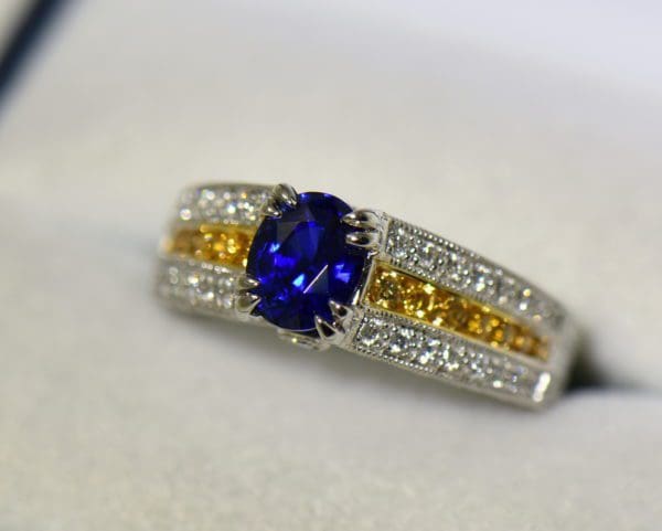 unheated royal blue sapphire ring with yellow and white diamond accents 5.JPG