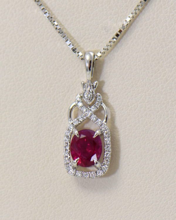 burmese ruby and diamond halo pendant in white gold.JPG