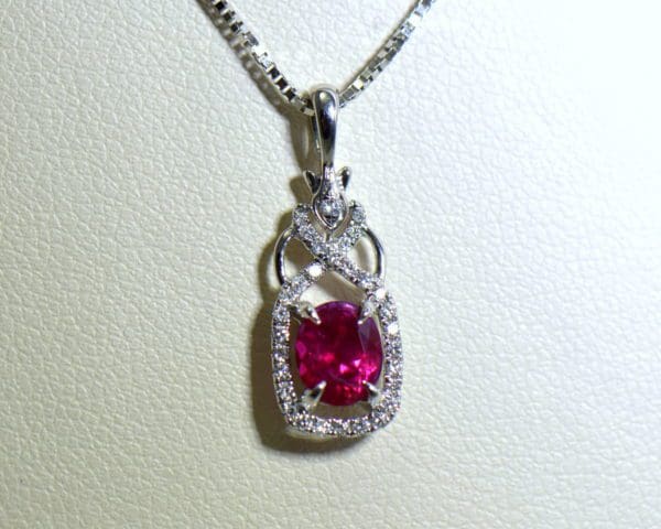 burmese ruby and diamond halo pendant in white gold 2.JPG