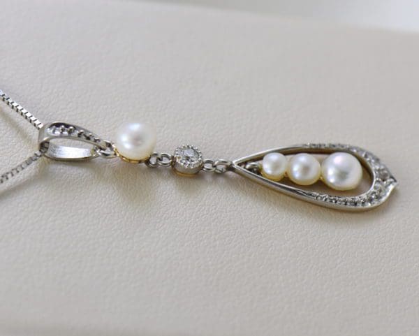 edwardian platinum over gold pearl pendant with mine cut diamond accents.JPG