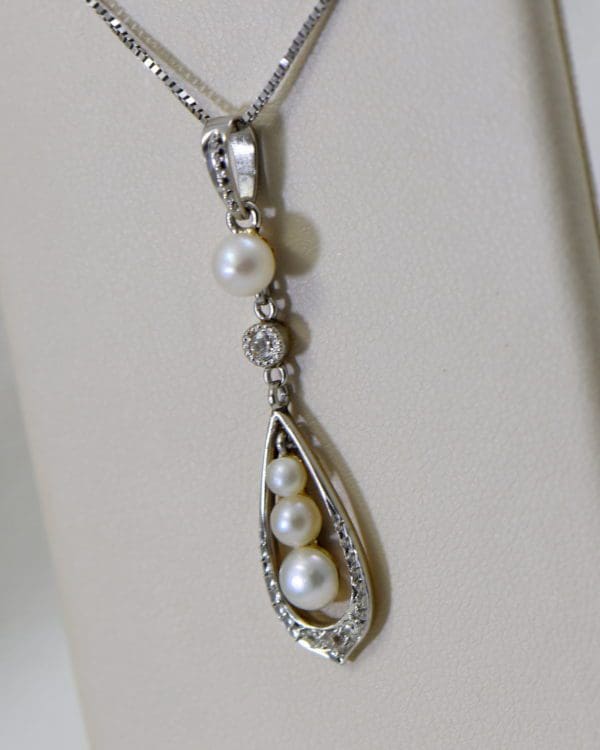 edwardian platinum over gold pearl pendant with mine cut diamond accents 3.JPG