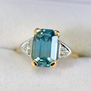 emerald cut blue zircon 3 stone ring in deco mounting 7.JPG