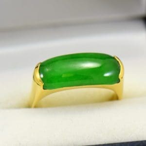 estate 18k yellow gold saddle ring with fine green jadeite jade.JPG