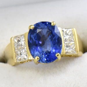 estate cocktail ring with 6ct cushion blue sapphire and princess diamonds in 18k yellow gold 3.JPG
