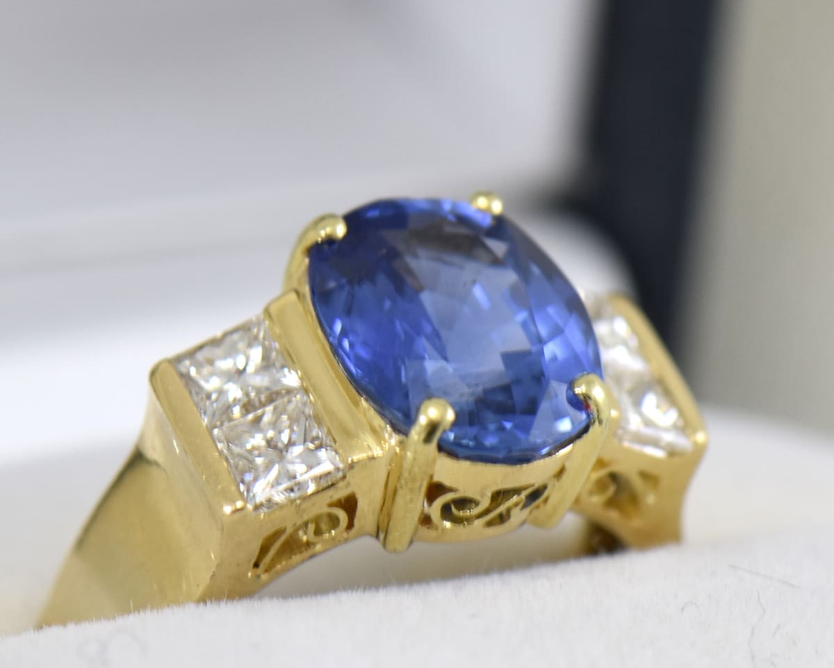 estate cocktail ring with 6ct cushion blue sapphire and princess diamonds in 18k yellow gold 5.JPG estate cocktail ring with 6ct cushion blue sapphire and princess diamonds in 18k yellow gold 5.JPG