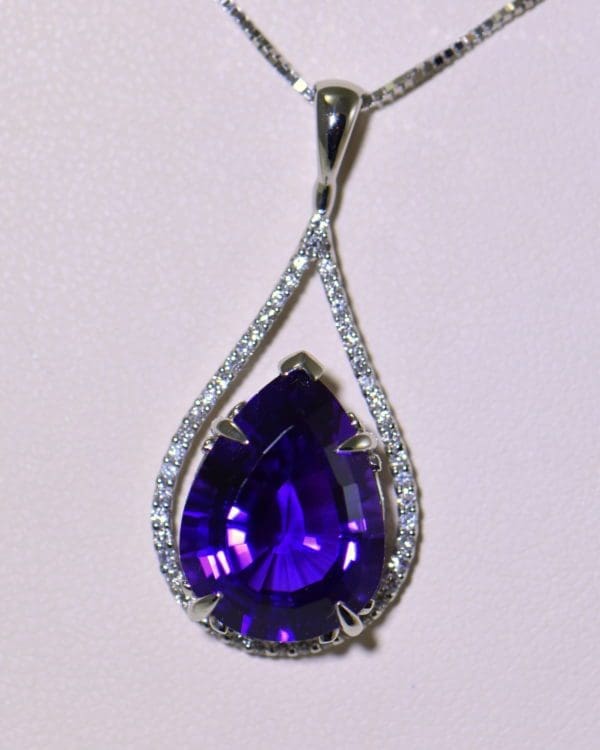 siberian amethyst pear shape set into diamond frame pendant 5.JPG