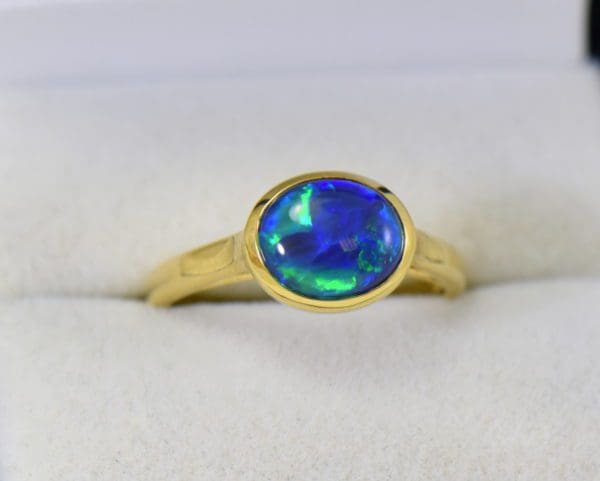 yellow gold solitaire black opal engagement ring with blue green color.JPG