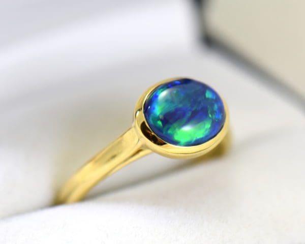 yellow gold solitaire black opal engagement ring with blue green color 3.JPG
