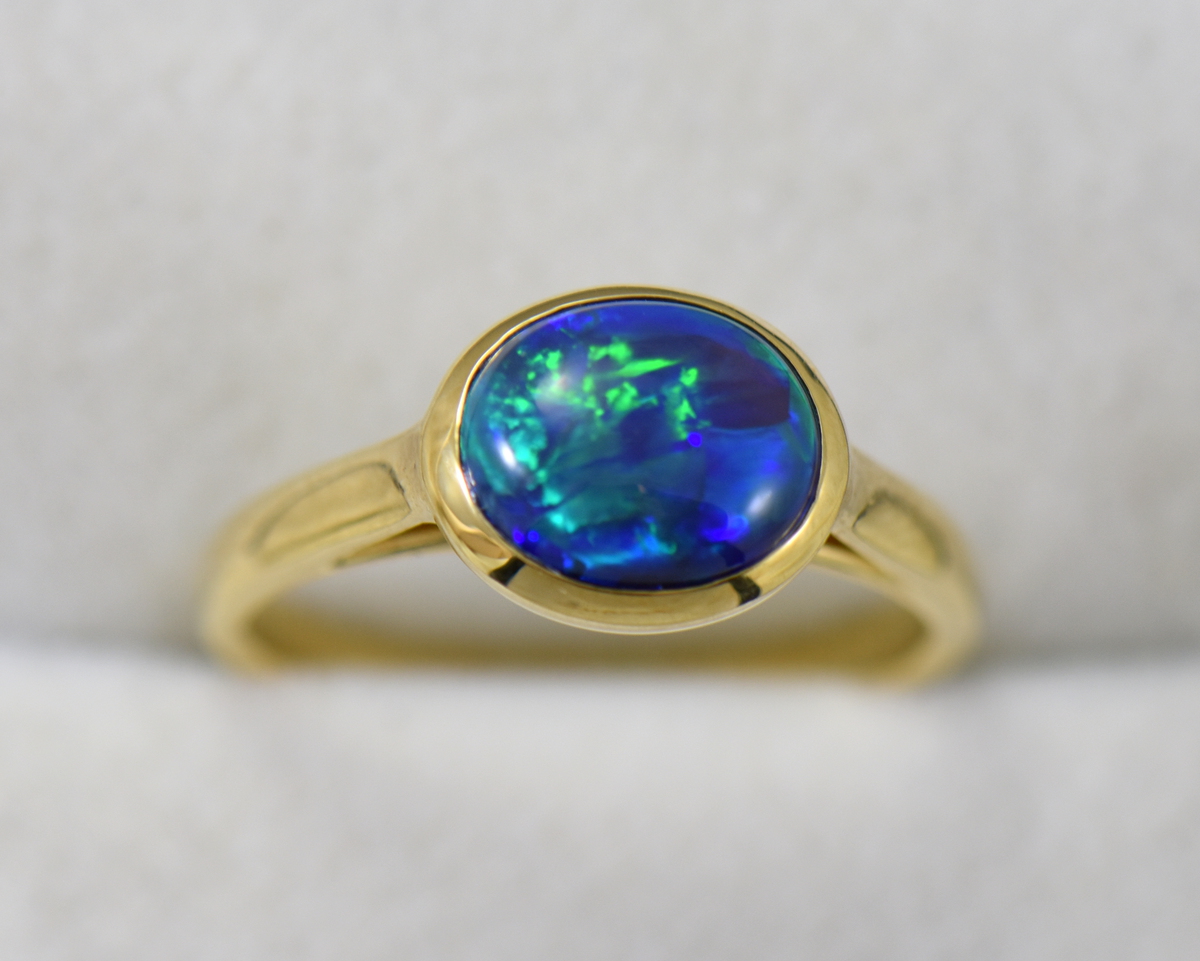 Black Opal Solitaire Engagement ring in Yellow Gold | Exquisite Jewelry ...