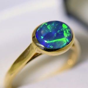 yellow gold solitaire black opal engagement ring with blue green color 5.JPG