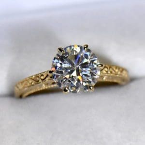 custom design gold solitaire with round moissanite vintage inspired.JPG