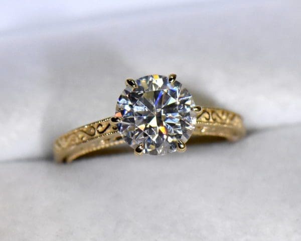custom design gold solitaire with round moissanite vintage inspired.JPG