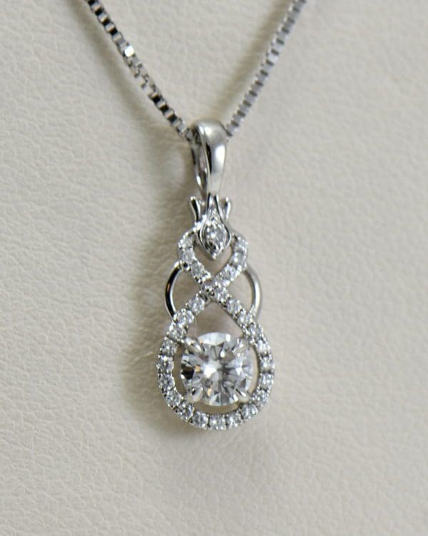 custom white gold and diamond pendant with .25ct diamond center.JPG