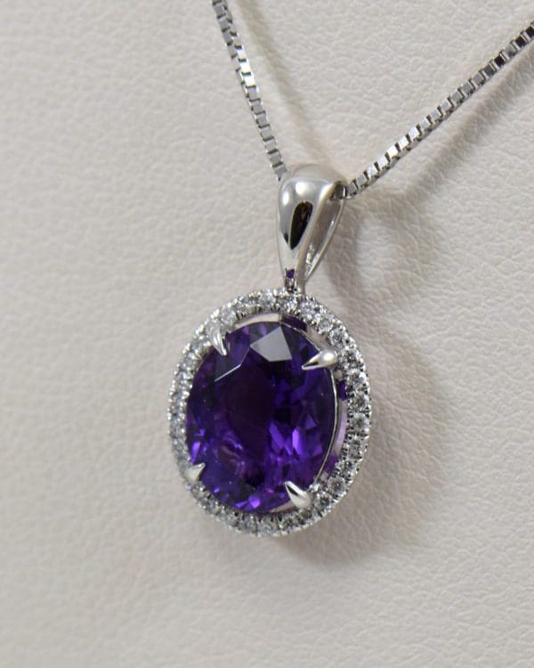 deep purple oval amethyst halo pendant in white gold.JPG