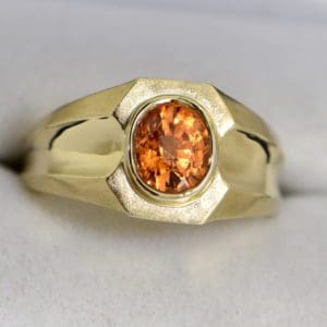 estate gents ring with oval spessartite garnet in yellow gold.JPG