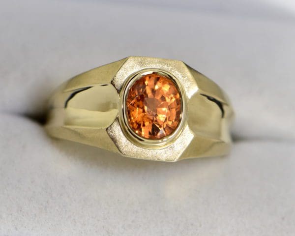 estate gents ring with oval spessartite garnet in yellow gold.JPG