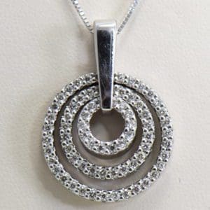 large estate diamond pendant with movable diamond circles.JPG