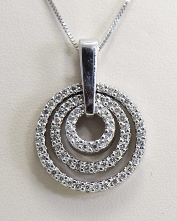 large estate diamond pendant with movable diamond circles.JPG