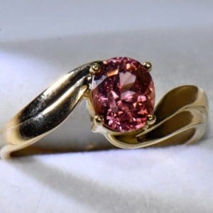 burmese orange pink spinel swirl ring in yellow gold.JPG