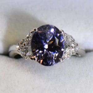 custom platinum ring with color shift violet spinel and diamonds.JPG