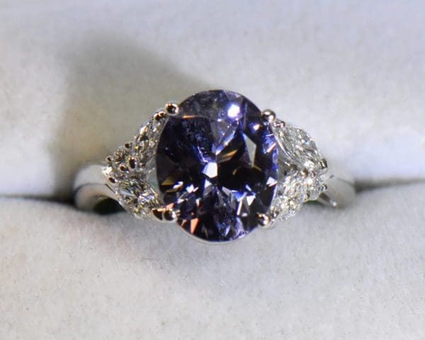 custom platinum ring with color shift violet spinel and diamonds.JPG
