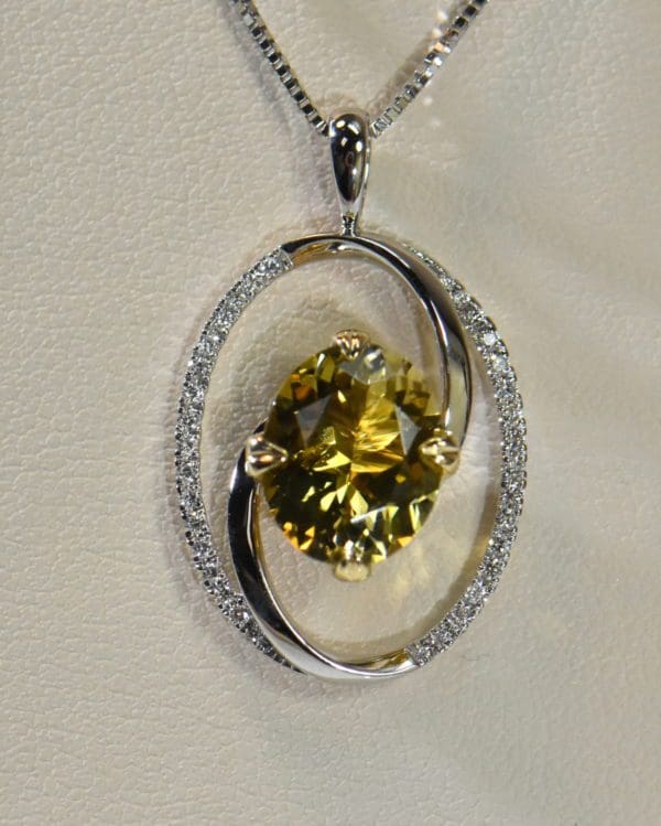 yellow and pink pendant bicolor tourmaline in oval diamond frame.JPG