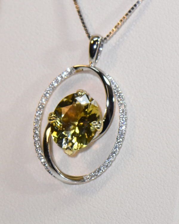 yellow and pink pendant bicolor tourmaline in oval diamond frame 2.JPG