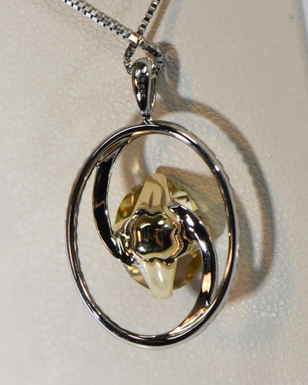 yellow and pink pendant bicolor tourmaline in oval diamond frame 3.JPG