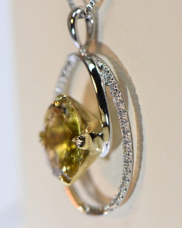 yellow and pink pendant bicolor tourmaline in oval diamond frame 4.JPG